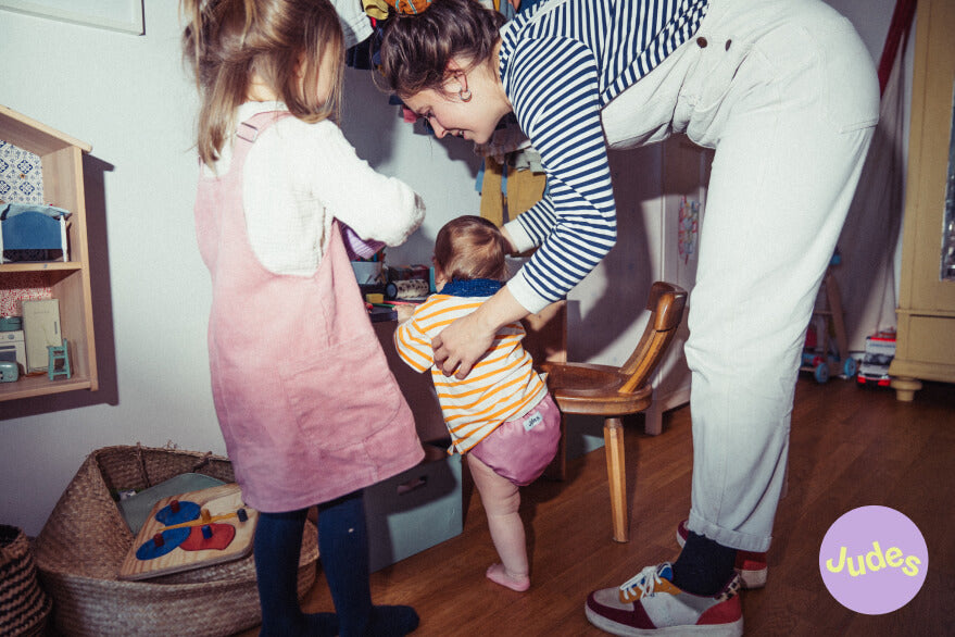 Mother with baby wearing a cloth diaper.